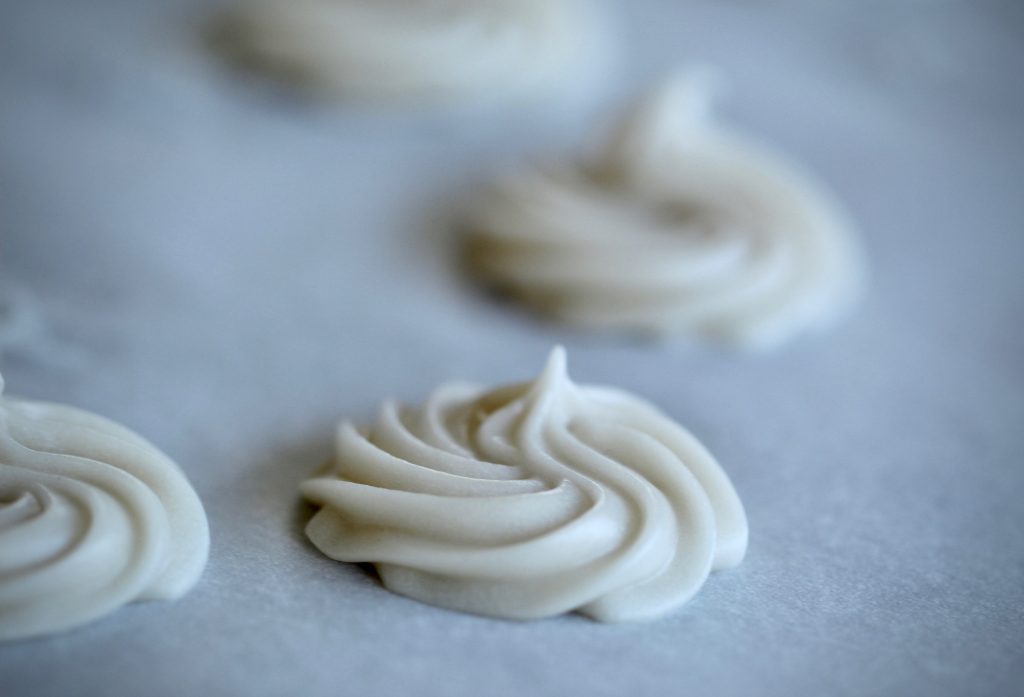 dairy free butter mints drying on parchment paper