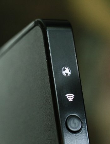 black wifi router with 2 lights on
